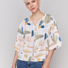 V-neck blouse with decorative buttons by Charlie B.