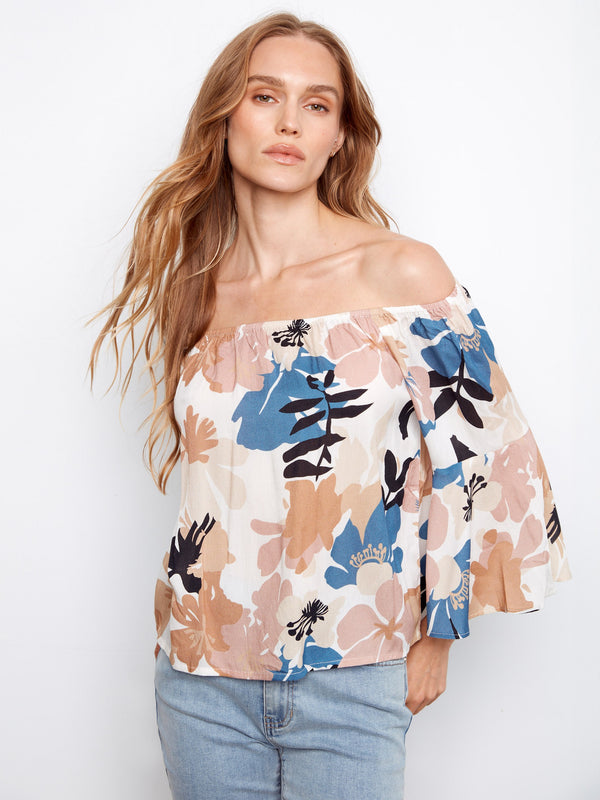 Floral design on this off-the-shoulder top is complemented by its airy, lightweight fabric by Charlie B.