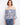Blouse featuring an off-the-shoulder design with a colorful abstract pattern in lightweight fabric by Charlie B.