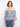 Blouse featuring an off-the-shoulder design with a colorful abstract pattern in lightweight fabric by Charlie B.