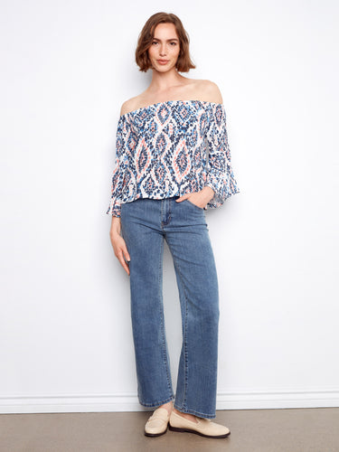 Lightweight blouse showcasing vibrant abstract patterns and stylish 3/4 sleeves by Charlie B.
