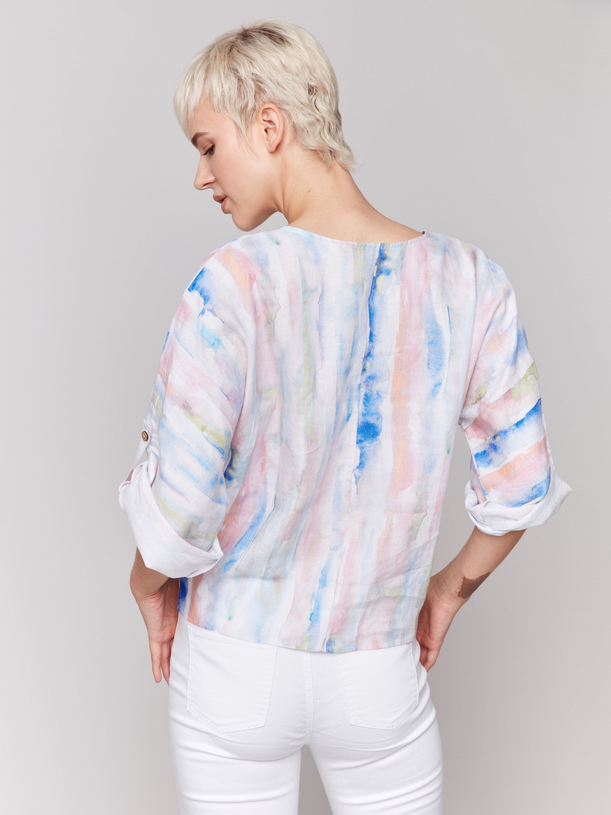 V-neck top with an abstract watercolor design by Charlie B.