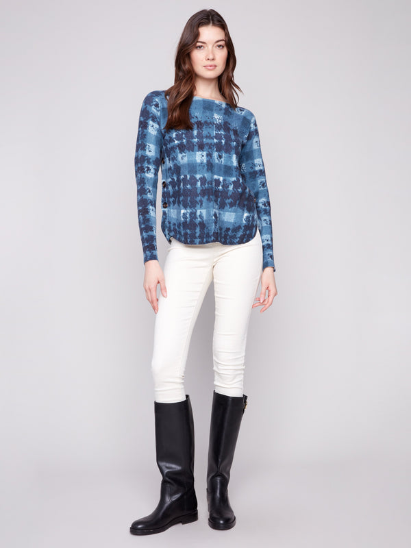 Elegant long-sleeve sweater with ribbed sleeves and a unique shadow print pattern by Charlie B.