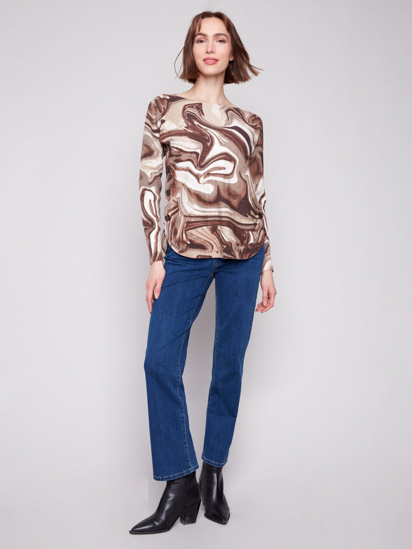 Stylish sweater with swirl print, highlighted by side button details for a modern touch by Charlie B.