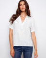 Blue striped blouse featuring a notch neckline, crafted from 100% cotton for comfort and style by Charlie B.