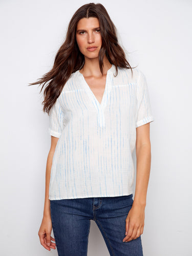 Elegant white blouse with subtle blue stripes and short sleeves, designed in breathable cotton fabric by Charlie B.