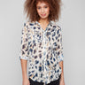 Semi-sheer animal print blouse with chest pockets and adjustable roll-up sleeves for versatile styling by Charlie B.