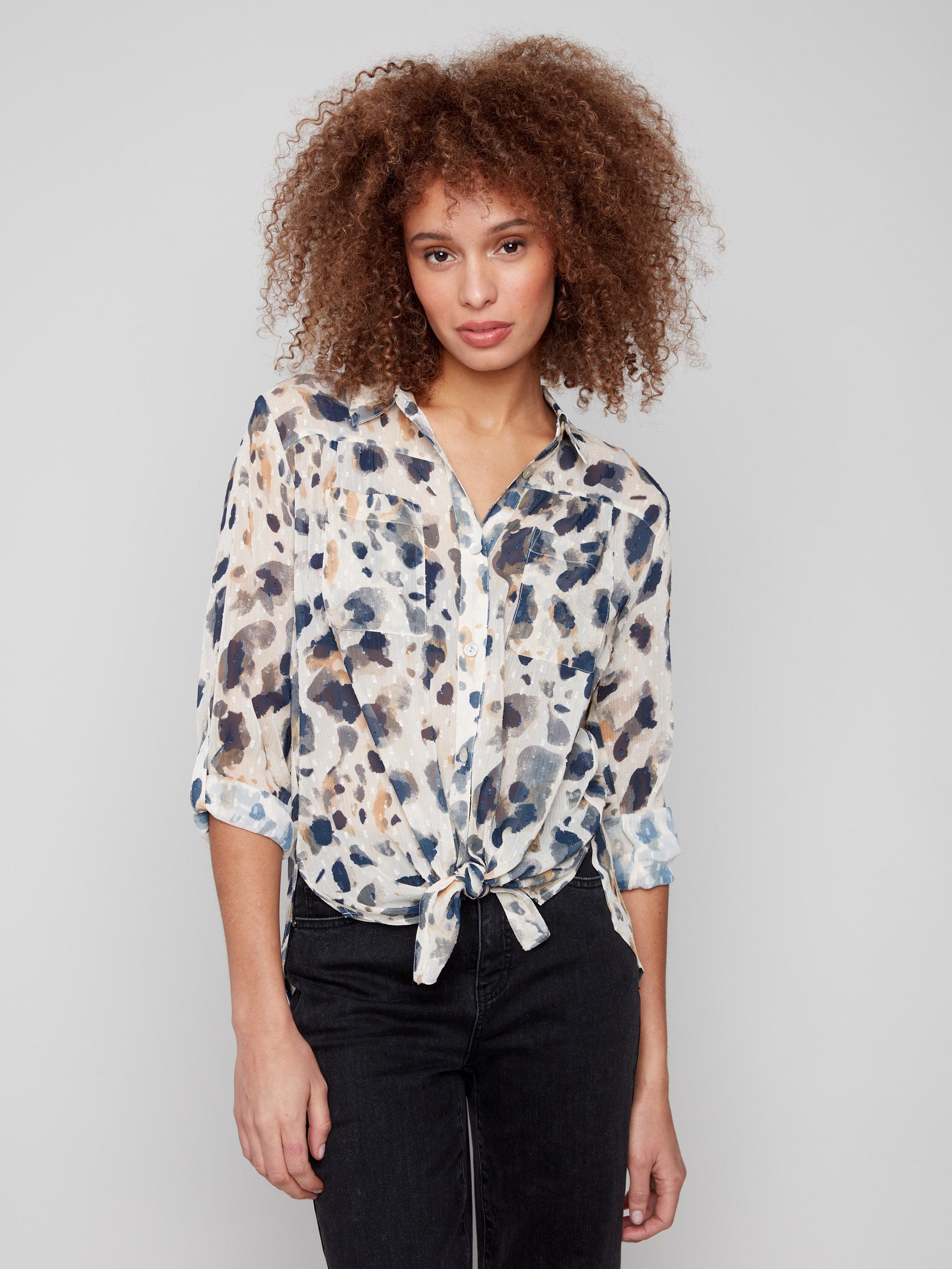 Chic button-down blouse featuring a tie-front option and stylish animal pattern, perfect for any occasion by Charlie B.