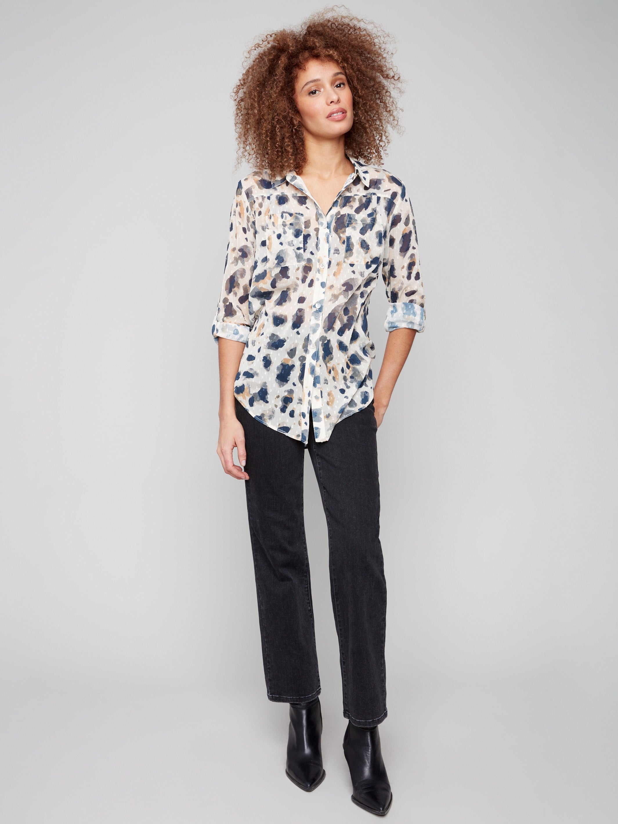 Animal pattern blouse showcasing adjustable roll-up sleeves and a chic button-down design for effortless elegance by Charlie B.