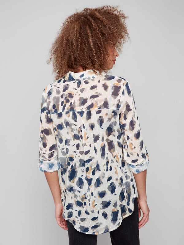 Fashion-forward semi-sheer blouse with an elegant shirt collar, perfect for adding flair to any outfit by Charlie B.