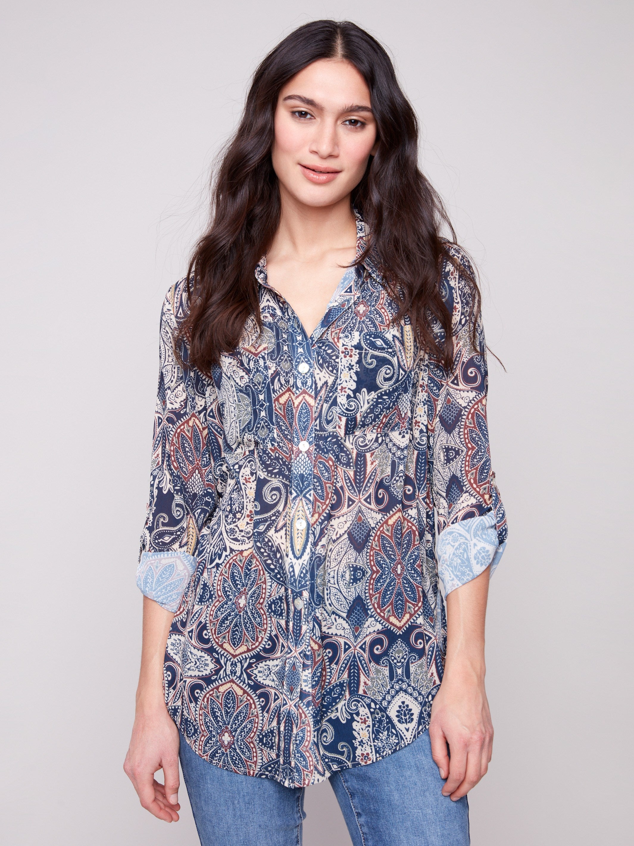 Paisley blouse featuring a semi-sheer fabric, perfect for layering and adding elegance to any outfit by Charlie B.