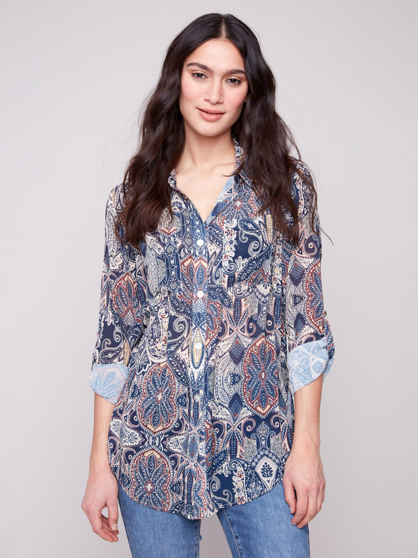 Paisley blouse featuring a semi-sheer fabric, perfect for layering and adding elegance to any outfit by Charlie B.