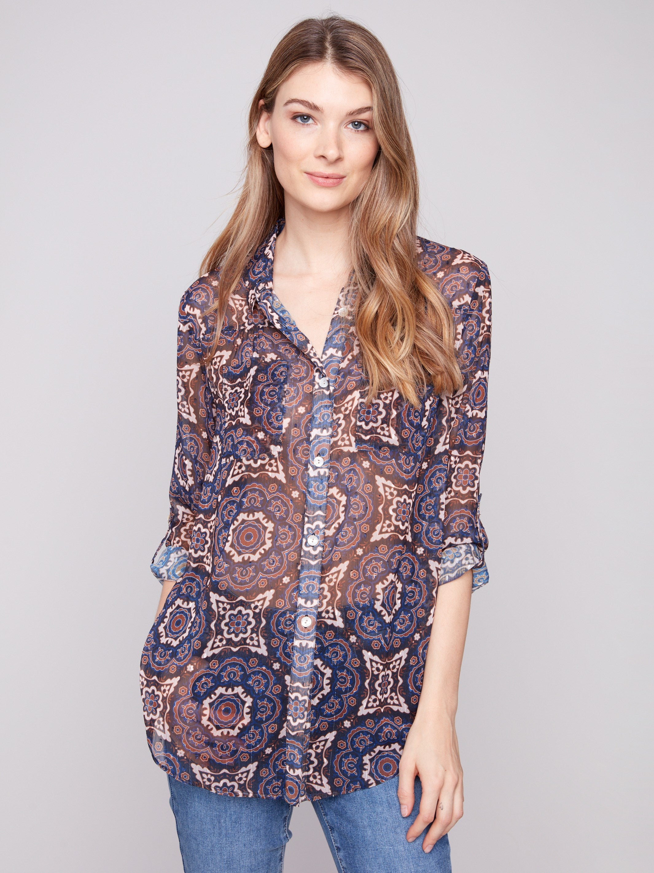 Semi-sheer blouse with medallion print, featuring adjustable roll-up sleeves for versatile style by Charlie B.