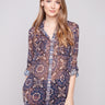 Semi-sheer blouse with medallion print, featuring adjustable roll-up sleeves for versatile style by Charlie B.