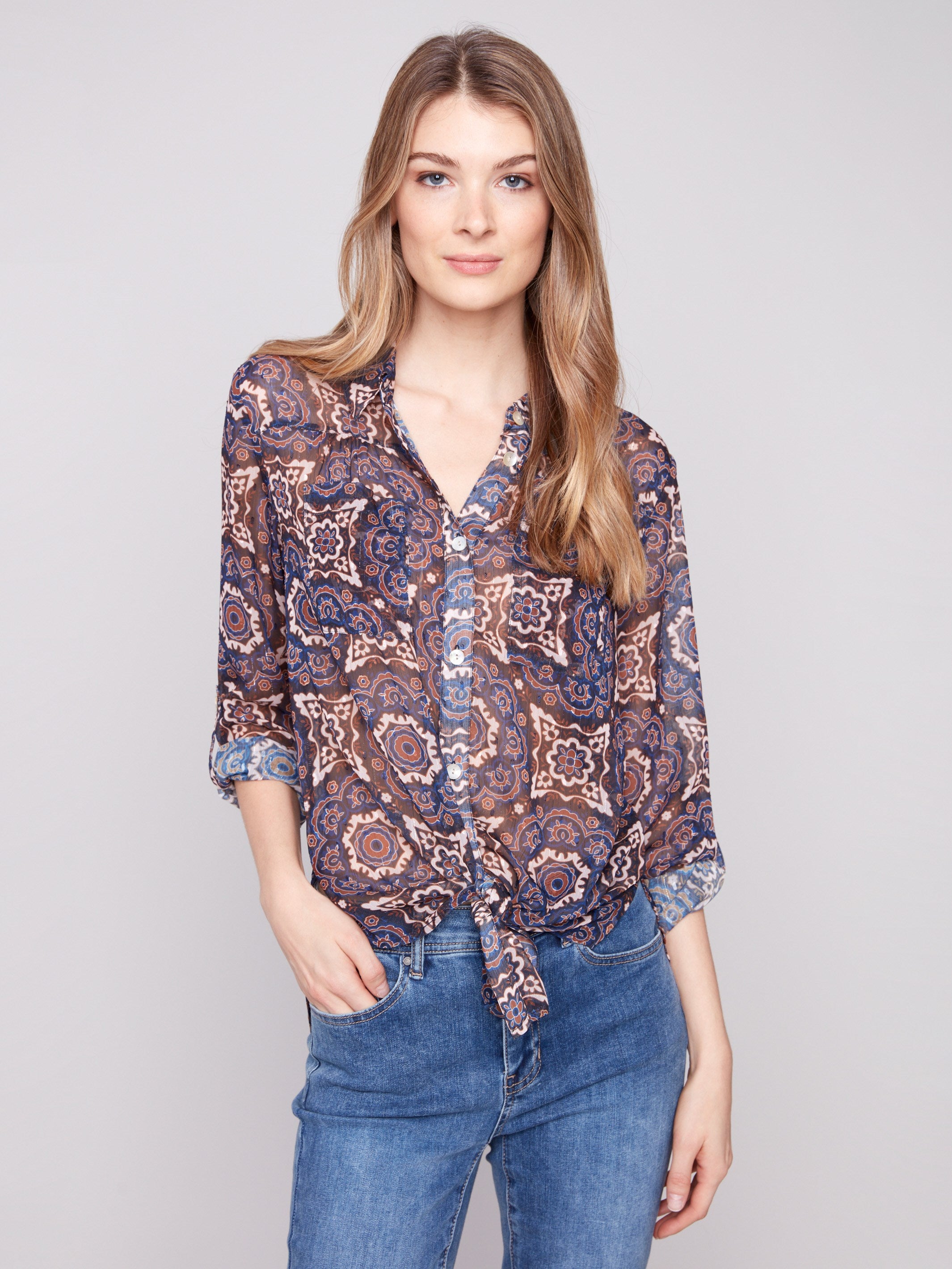 Button-down dobby blouse with a chic tie-front option and intricate medallion pattern by Charlie B.