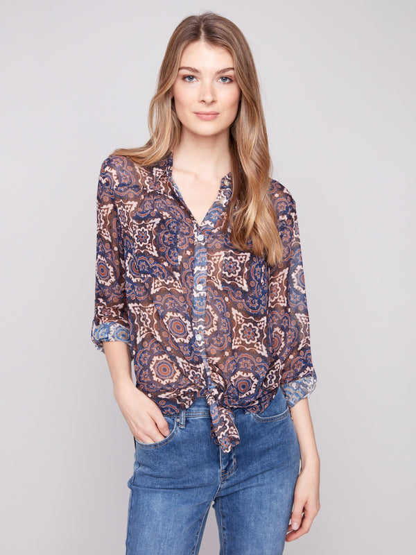 Button-down dobby blouse with a chic tie-front option and intricate medallion pattern by Charlie B.