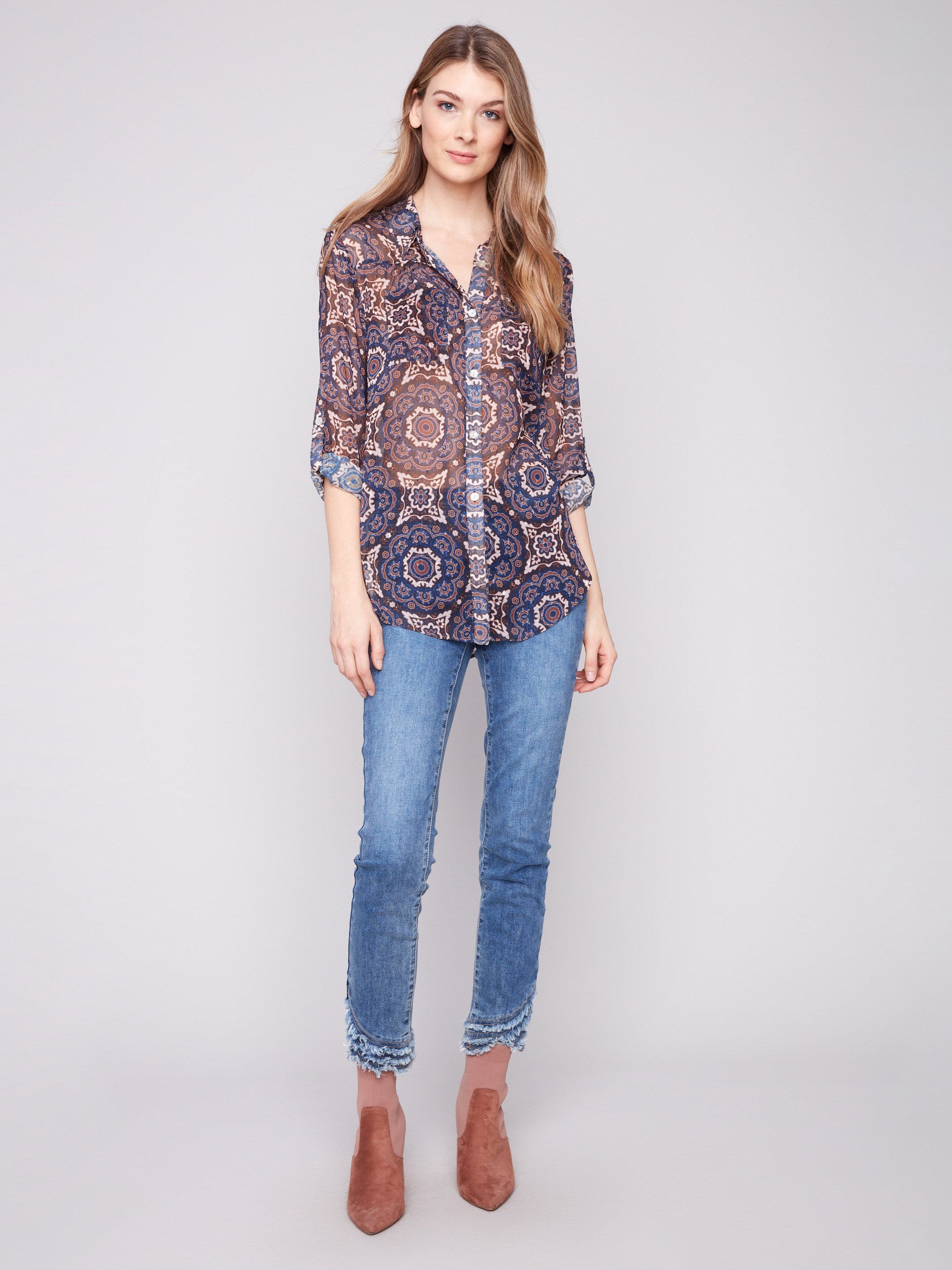 Printed blouse with side slits and medallion design, offering comfort and style in one piece by Charlie B.