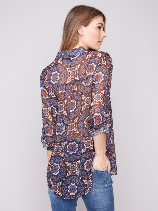 Medallion print dobby blouse featuring a convenient chest pocket for added functionality by Charlie B.