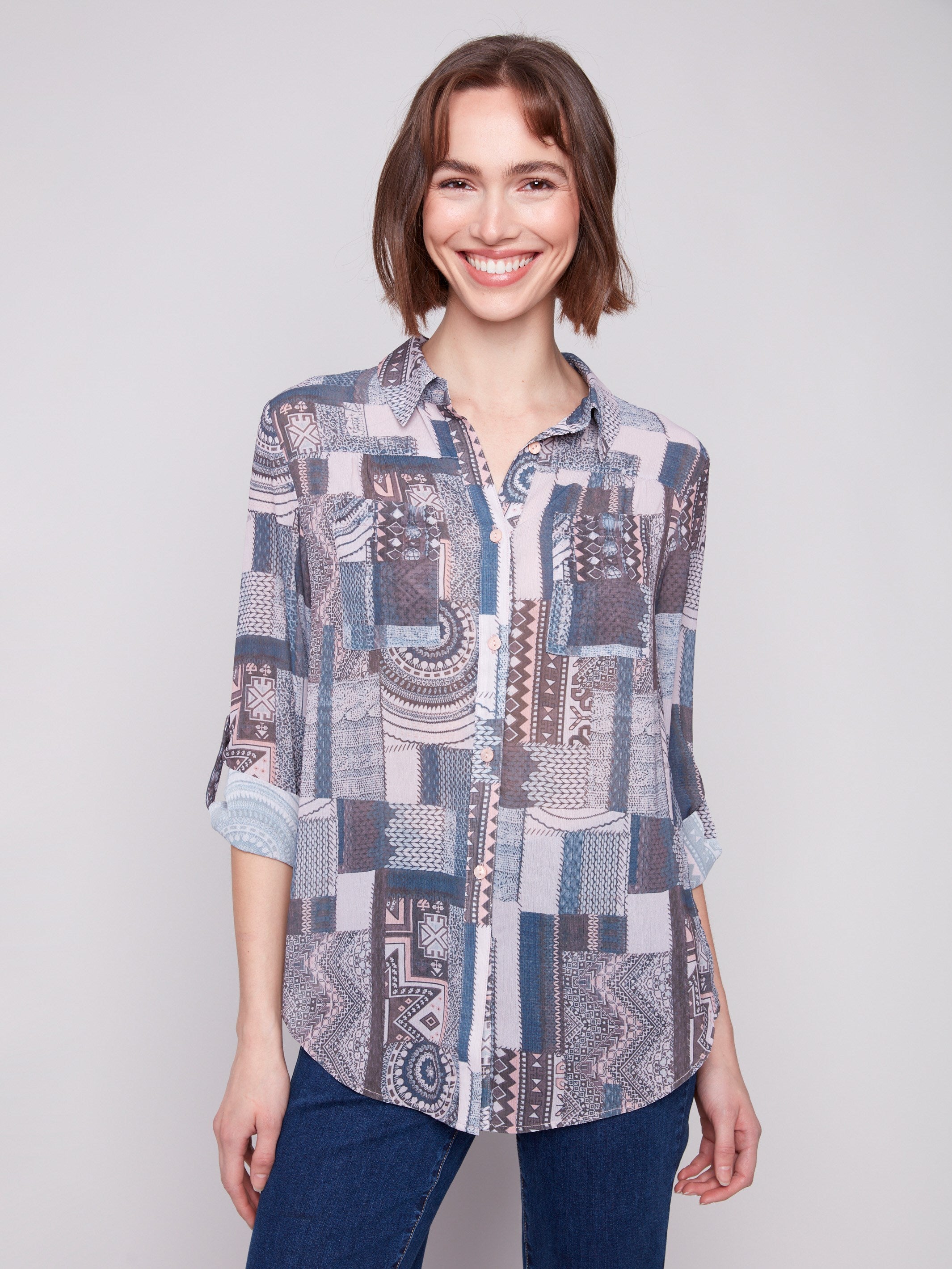 Patchwork blouse with semi-sheer fabric and adjustable roll-up sleeves for versatile styling by Charlie B.