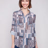Patchwork blouse with semi-sheer fabric and adjustable roll-up sleeves for versatile styling by Charlie B.