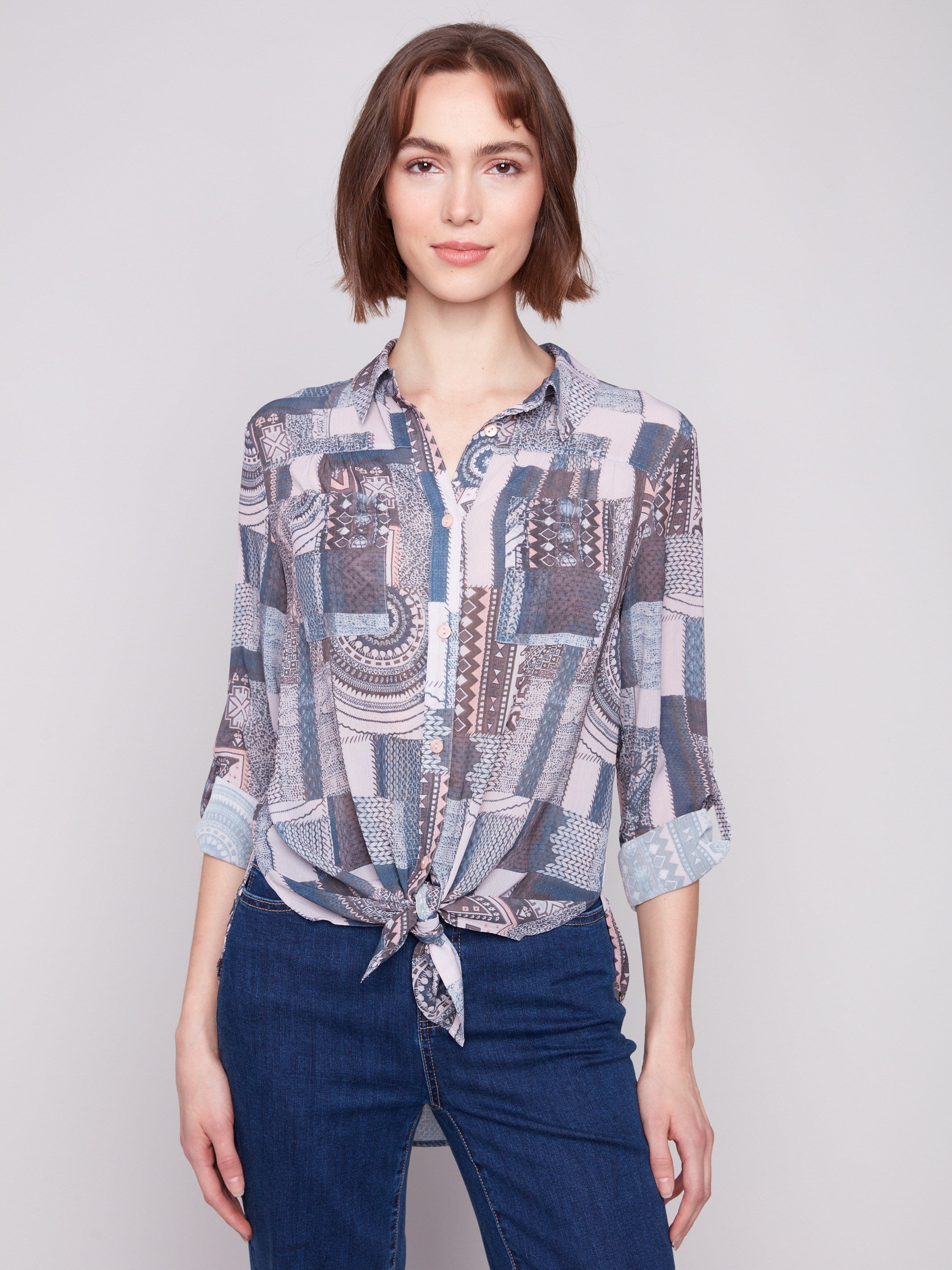Chic patchwork blouse featuring a tie-front option, perfect for casual or dressed-up looks by Charlie B.