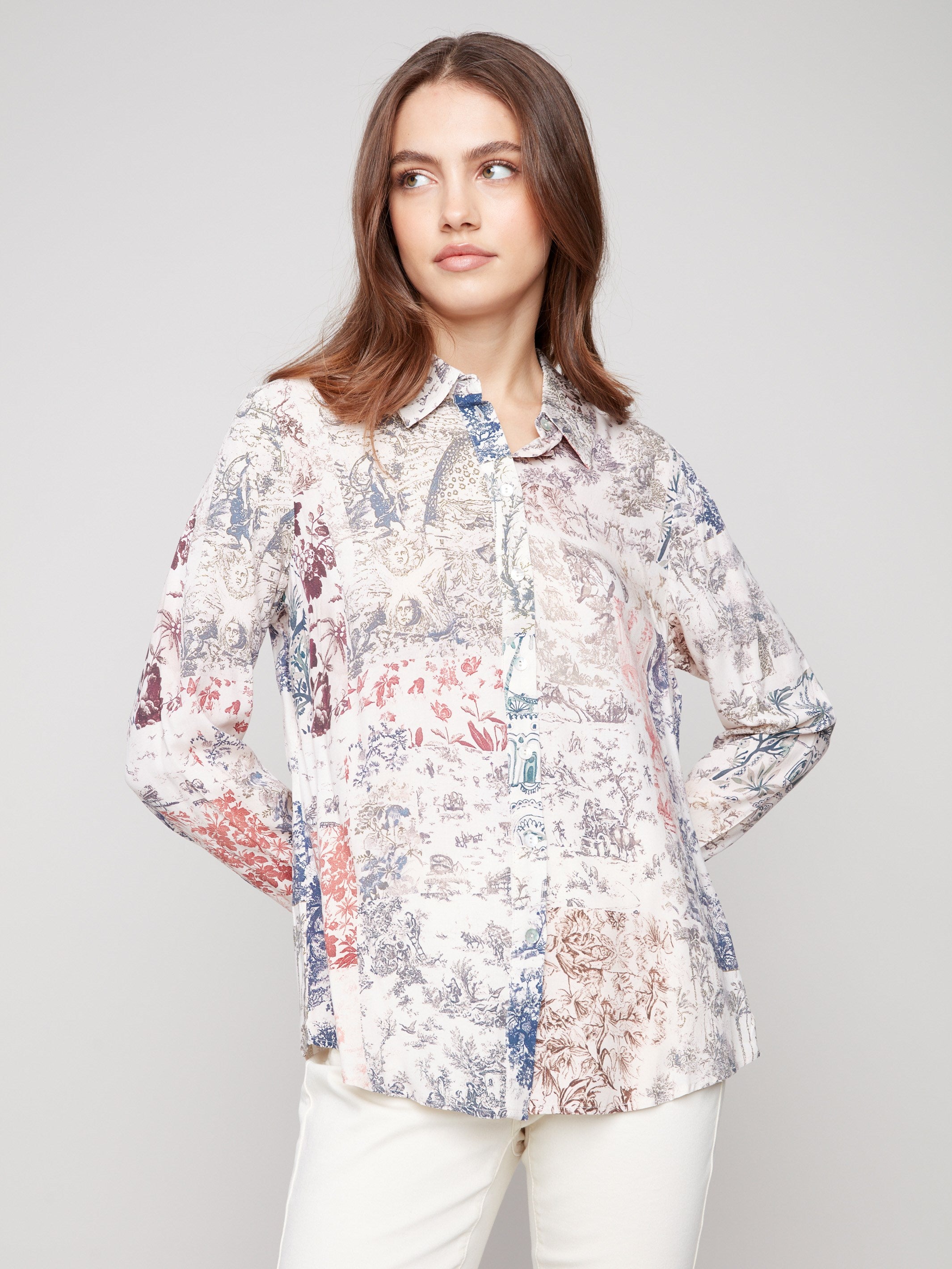 Long sleeve shirt with intricate toile patterns featuring button-down design and foldable cuffs by Charlie B.