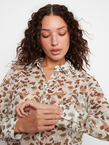 Experience the elegance of long sleeves with this semi-sheer blouse, perfect for any occasion by Charlie B.