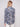 Long sleeve shirt with intricate floral patterns in blue and cream shades, featuring button-down design and foldable cuffs by Charlie B.