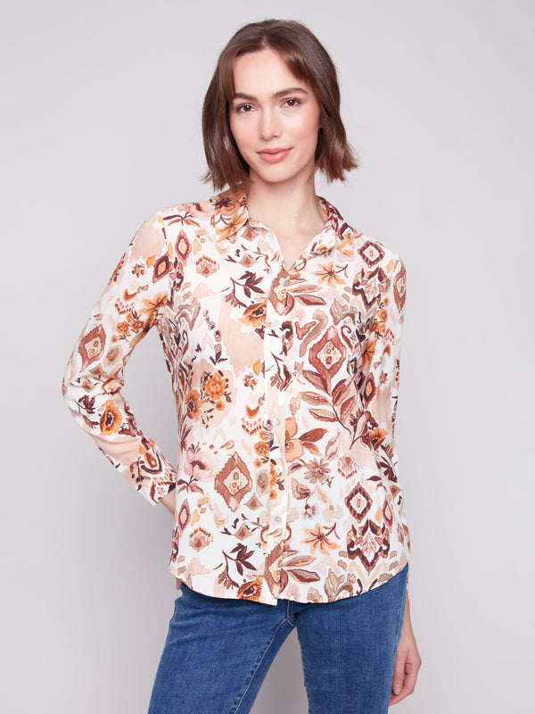 Long sleeve shirt with intricate geometric patterns in brown and cream shades, featuring button-down design and foldable cuffs by Charlie B.