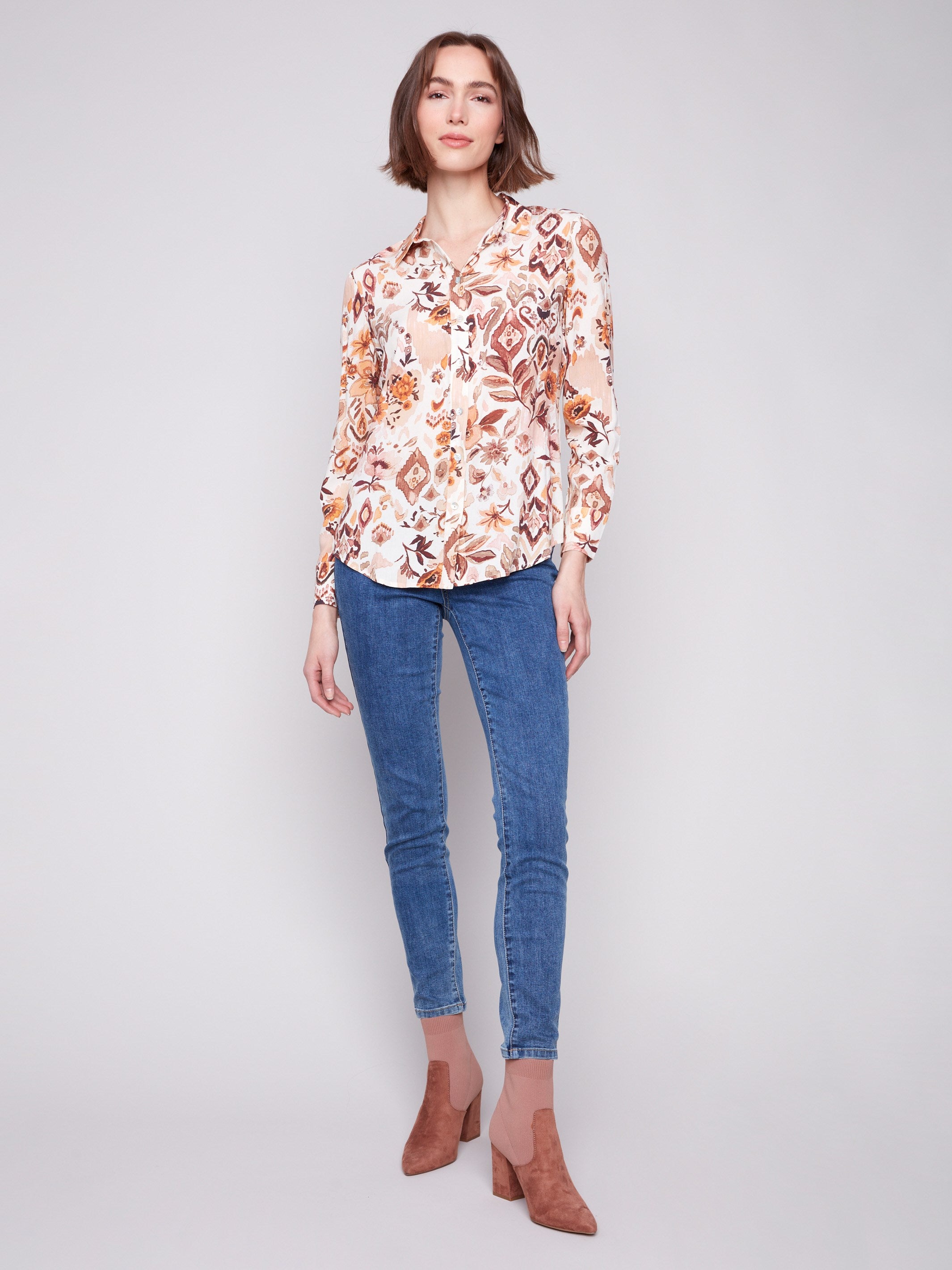Long sleeve shirt with intricate geometric patterns in brown and cream shades, featuring button-down design and foldable cuffs by Charlie B.