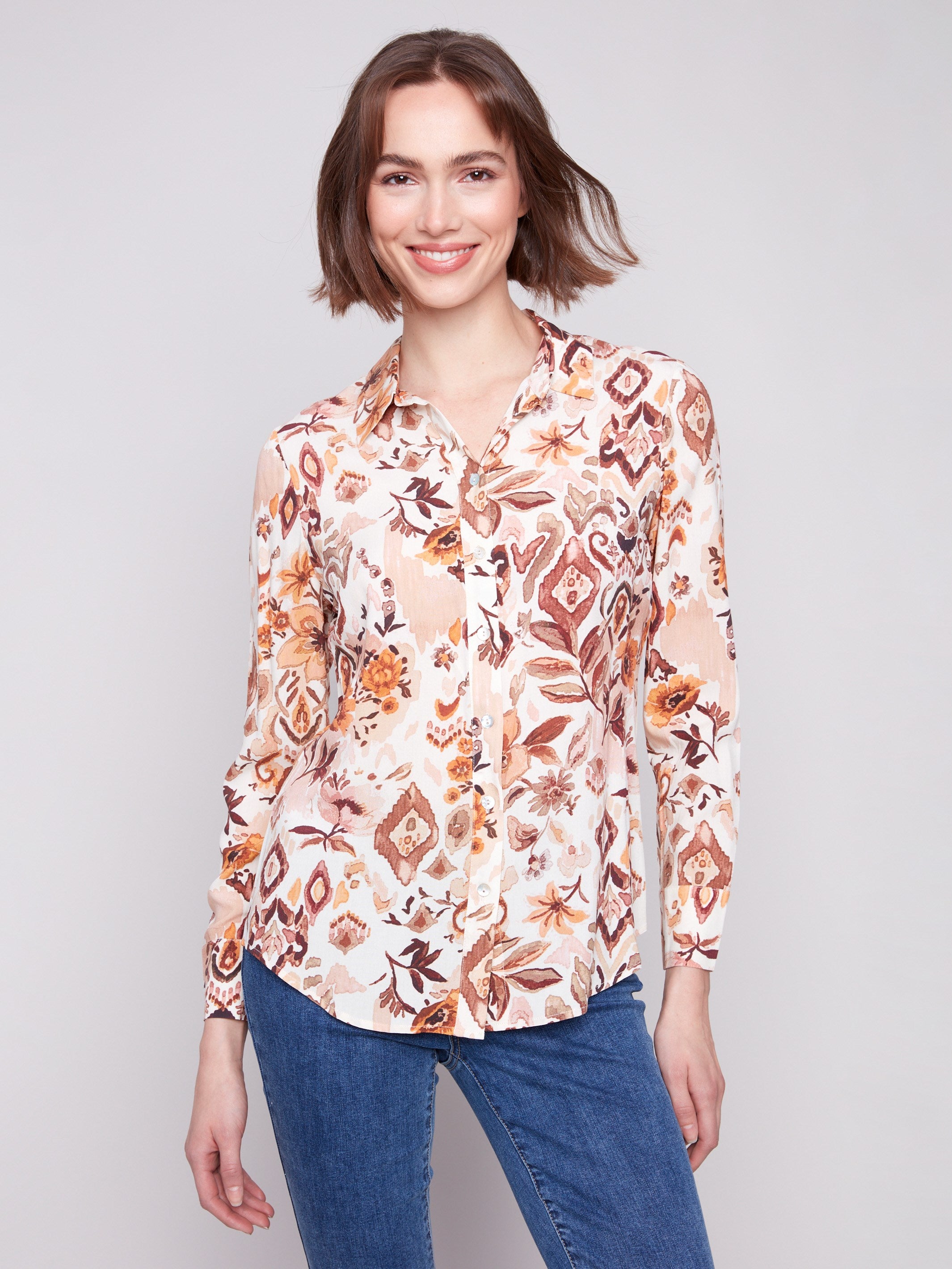 Long sleeve shirt with intricate geometric patterns in brown and cream shades, featuring button-down design and foldable cuffs by Charlie B.