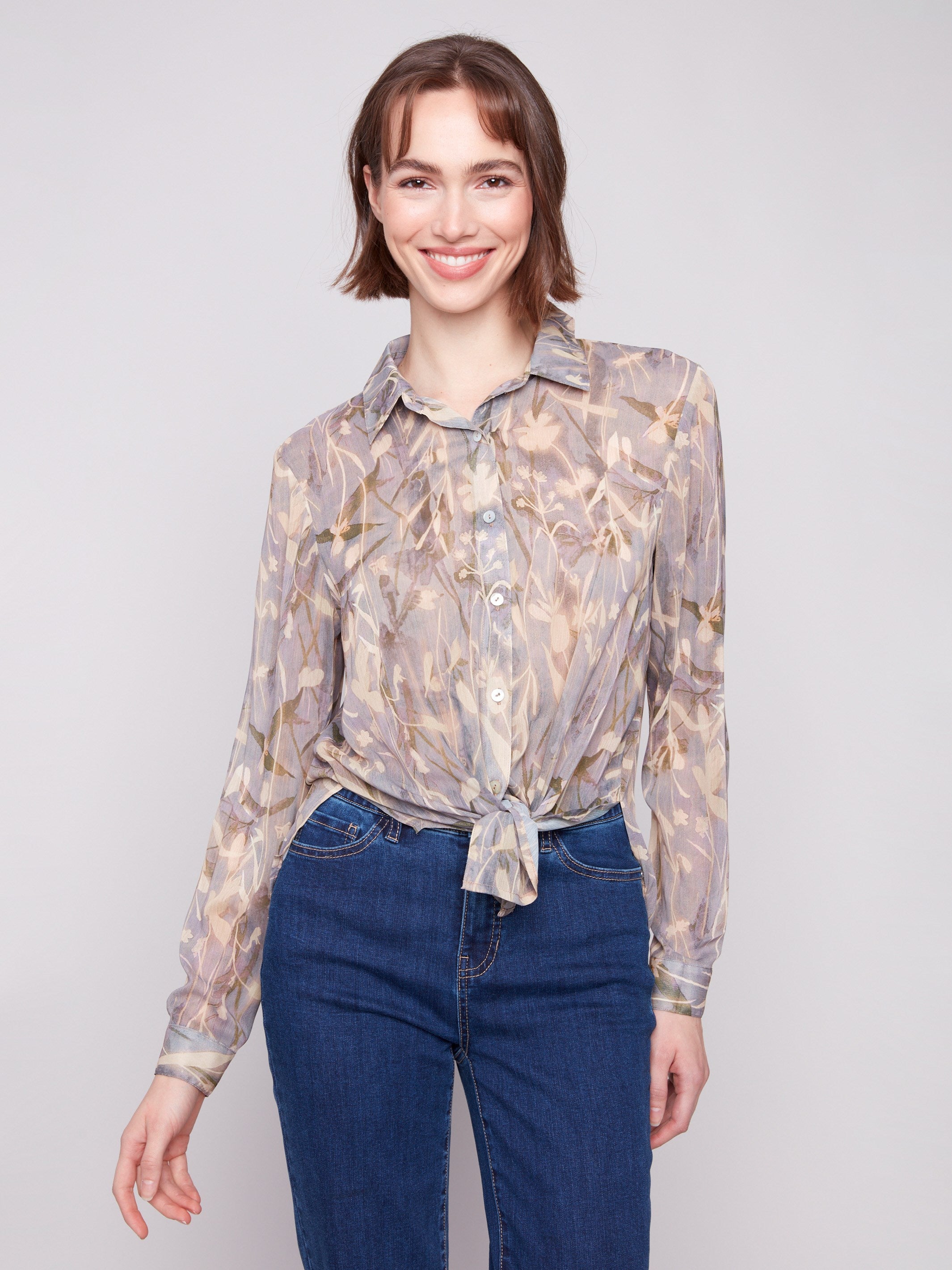 Chiffon shirt showcasing a floral print and two-way styling option, tied at the front for a chic look by Charlie B.