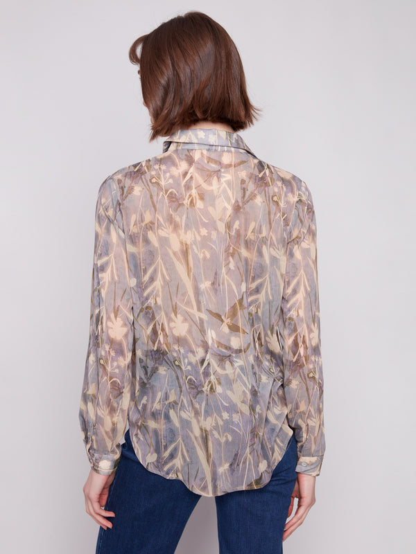 Semi-sheer fabric highlights the intricate floral print on this stylish long sleeve chiffon shirt by Charlie B.