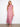 The cap ruffle sleeves add a whimsical charm to this vibrant floral maxi dress design by Charlie B.