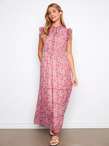 The cap ruffle sleeves add a whimsical charm to this vibrant floral maxi dress design by Charlie B.