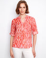 Scarlet geometric blouse featuring a half-button design and roll-up sleeves, perfect for casual elegance by Charlie B.