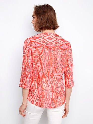Artistic floral blouse showcasing a Henley neckline and chic pattern, adding flair to any outfit by Charlie B.
