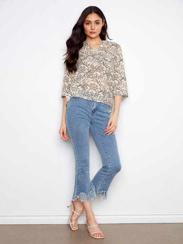 Beautifully patterned floral top that combines elegance with a functional chest pocket, great for casual days out. By Charlie B.