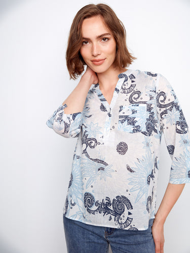 Adjustable roll-up sleeves make this floral top perfect for transitioning between seasons, styled with classic jeans. By Charlie B.