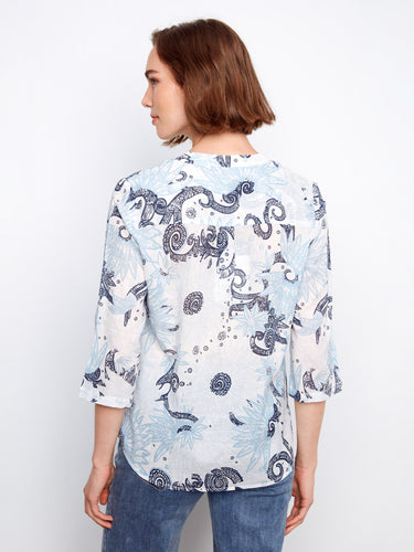 The intricate pattern on this blouse complements its relaxed fit and adjustable sleeves for everyday wear. By Charlie B.