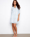 Light blue Henley shirt dress with chest pocket and 3/4 sleeves, offering a relaxed fit by Charlie B.