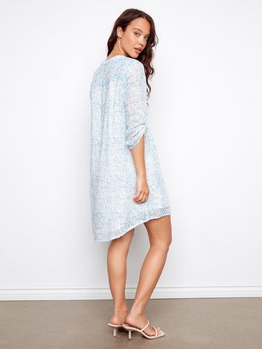 Blue ornament patterned Henley dress showcasing a stylish high-low hem for added flair by Charlie B.
