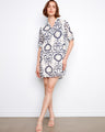 Patterned dress featuring a chest pocket, adding functionality and style to your wardrobe. Perfect for casual outings. By Charlie B.