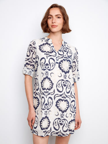 Elegant dress with a Henley neckline, showcasing intricate patterns for a chic look. Ideal for both day and night wear. By Charlie B.