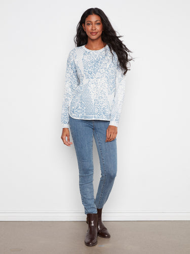 Chic sweater with drop shoulders and intricate design, offering a relaxed fit in premium cotton material. By Charlie B.