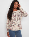 This floral top features a classic crew neckline, adding elegance to any outfit. Made from 100% cotton for comfort by Charlie B.