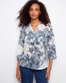 Floral Henley blouse featuring a half-button design, perfect for casual outings. Experience style and comfort by Charlie B.