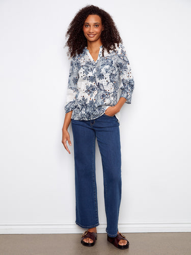 Henley blouse with a beautiful floral pattern, designed with adjustable roll-up sleeves for versatile wear by Charlie B.