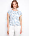 Blue floral top with a crew neckline, featuring a stylish front tie knot at the hem. Made from 100% cotton for comfort by Charlie B.