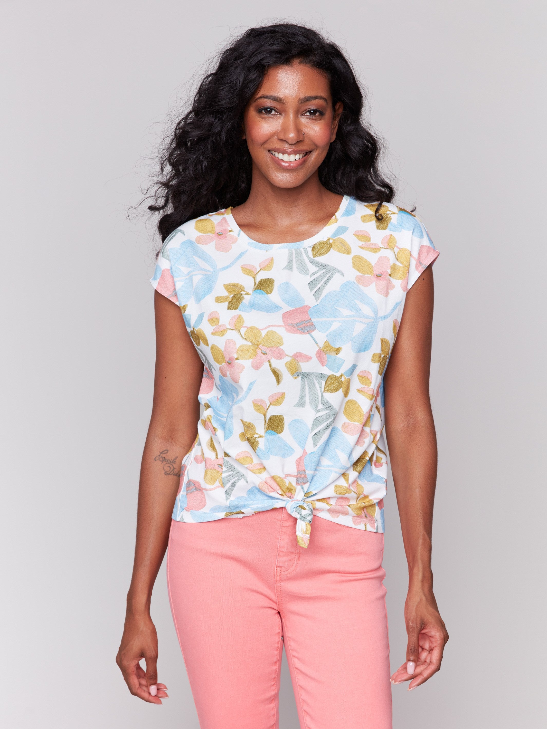 Cotton top with vibrant floral prints and a front knot detail by Charlie B.